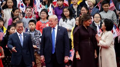 Left to right, South Korean president Moon Jae-in, US president Donald Trump, US first lady Melania Trump and South Korean first lady Kim Jung-Sook attend the welcoming ceremony at the presidential Blue House in Seoul, South Korea. Chung Sung-Jun / EPA