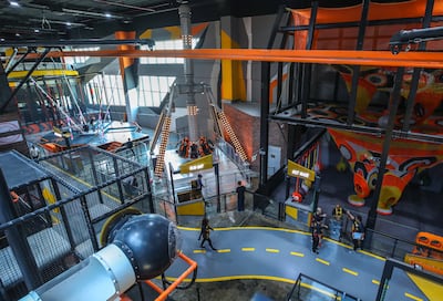 The indoor adventure park offers physical challenges and team-based activities. Victor Besa / The National