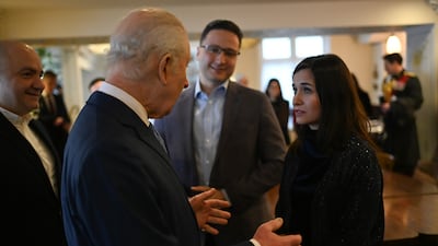 King Charles with Syrian filmmaker Waad Al Kateab at Imad's Syrian Kitchen. Getty Images