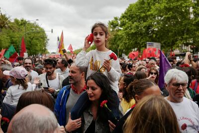 People gather to mark the 50th anniversary of Portugal's Carnation Revolution in Lisbon. Reuters