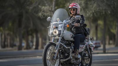 Gabrielle Bou Rached rides her Harley-Davidson to work in Abu Dhabi. Vidhyaa for The National