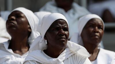 Mourners attend the state funeral service for former President Robert Mugabe at the National Sports Stadium in Harare. The burial has been delayed for at least a month until a special mausoleum can be built for his remains. AP Photo