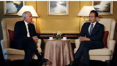 Robert Gates, the US defence secretary, left, with Lee Myung-bak,South Korea's president, in Singapore. Mr Gates called for a unified front to "deter further provocations".
