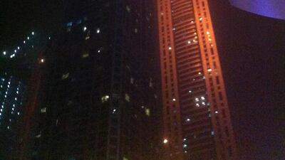 An iPhone picture of the Torch tower in the Marina on fire. Image supplied by a bystander.