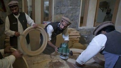 Men make wooden panels in a classroom at the Mashal de-radicalisation centre run by the Pakistani army in Gulibagh in Pakistan's Swat Valley.