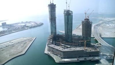 The stalled $650 million project comprises three twisting towers of 54, 52 and 43 storeys, which are to contain a hotel, serviced flats and regular apartments. Razan Alzayani / The National