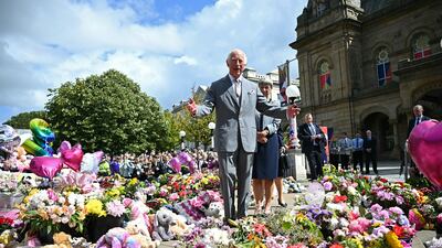 King Charles III views tributes outside Southport Town Hall, during his visit to meet members of the local community, following the July 29 attack at a children's' dance party in Southport. Getty Images