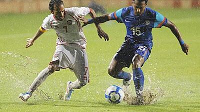 The UAE captain Ali Al Waheibi challenges for the ball during their 2-2 draw with India in Delhi. The UAE advanced to the group stages of qualifying for the 2014 World Cup.