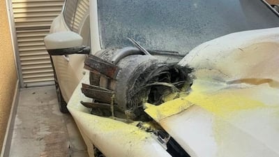 The remains of a projectile on top of a damaged vehicle at an apartment building in Riyadh following a Houthi strike. AFP/ SPA handout