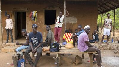 Timber loggers gather at a campsite in Coli. Joe Penney / Reuters