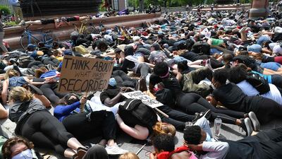 People lay down in protest for the death of George Floyd near the US Capitol, in Washington, DC. AFP