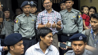 Detained Myanmar journalists Kyaw Soe Oo and Wa Lone are escorted by after appearing before a court in Yangon. AFP