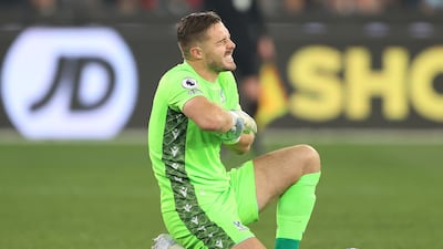Crystal Palace goalkeeper Jack Butland in pain after saving a first-half shot from Anthony Martial. Butland was forced off due to the injury. Getty