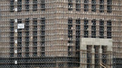 Construction labourers work at the future headquarters Ministry of Environment in the government district of the New Administrative Capital east of Cairo. Reuters