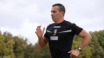 Italian football referee Daniele Doveri trains in the Villa Pamphili park in Rome. Reuters