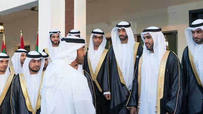 Sheikh Mohamed bin Zayed, Crown Prince of Abu Dhabi and Deputy Supreme Commander of the UAE Armed Forces, speaks with grooms during a mass wedding held at Majlis Al Manhal. Rashed Al Mansoori / Ministry of Presidential Affairs