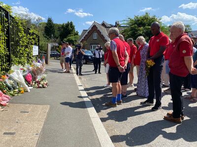 Members of Wimbledon Common Golf Club hold a minute's silence. PA
