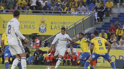 Real Madrid’s Cristiano Ronaldo, centre, prepares to shoot. Jesus de Leon / AP Photo