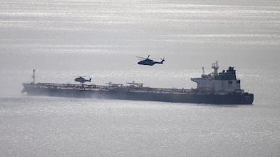 Military helicopters circle a tanker carrying sanctioned oil. Getty images