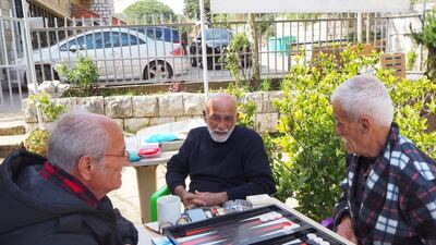 Maroun, Michel and Khalil play backgammon at Beit Judoodna. Emily Lewis