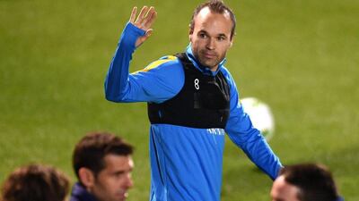 Andres Iniesta of Barcelona waves at the team’s training session in Yokohama on Monday. Franck Robichon / EPA