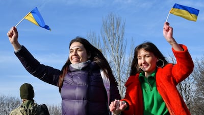 People wave Ukrainian national flags in Kramatorsk. AP Photo