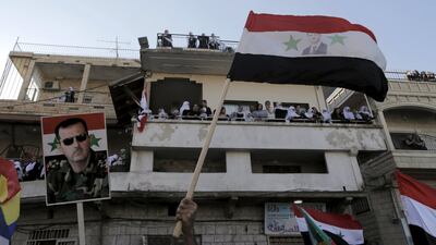 Druze protesters in the Golan Heights call on Bashar Al Assad to protect their Syrian kin. The civil war has claimed lives and devastated the economies of Syria and its neighbours (Ammar Awad / Reuters)