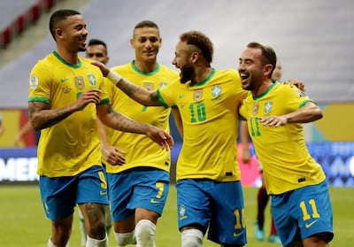 Brazil's Neymar celebrates scoring their second goal against Venezuela with teammates. Reuters