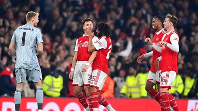 Kieran Tierney celebrates with Arsenal teammate Mohamed Elneny after scoring. Getty