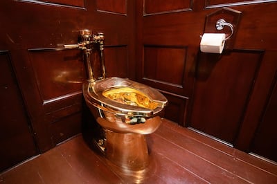 "America", a fully-working solid gold toilet, created by artist Maurizio Cattelan, is seen at Blenheim Palace on September 12, 2019 in Woodstock, England. Leon Neal / Getty Images