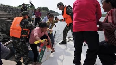 Paramilitary policemen evacuate locals as Typhoon Megi approaches Zhongshan in Guangdong province, China.