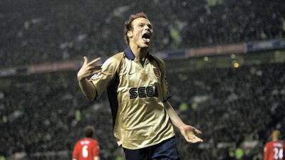 Fredrik Ljungberg of Arsenal celebrates during match at Old Trafford in 2002. Arsenal won the match 1-0, and were crowned Premier League champions. Getty Images