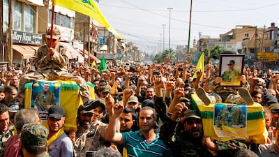Hizbollah supporters carry the coffins of fighters killed in an assault led by the group on extremists in the mountainous Jurud Arsal region on the Lebanon-Syria border during their funeral in a southern suburb of Beirut on July 31, 2017. AFP
