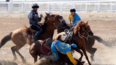 Kazakh and US horsemen take part in kok-boru. EPA