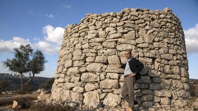 Shehadeh, shown near an historic qasr structure on the outskirts of Ramallah, exudes patience. "You have to think long term." Heidi Levine for The National