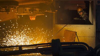 A steelworker operates machinery at the Ilich iron and steel plant in the southern coastal town of Mariupol. Vasily Fedosenko / Reuters