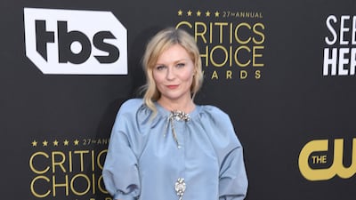 US actress Kirsten Dunst arrives in a powder blue Julie de Libran Couture gown. AFP