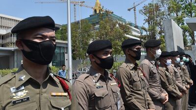 Police stand guard outside the Thai parliament building in Bangkok. A government office in the southern province of Yala was attacked on Tuesday as it was about to host a meeting about the Covid-19 pandemic. AFP