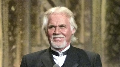 Singer Kenny Rogers accepts a special Career Achievement Award at the 36th annual Academy of Country Music Awards May 9, 2001 in Los Angeles. REUTERS