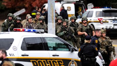 Law enforcement officers secure the scene. AP Photo