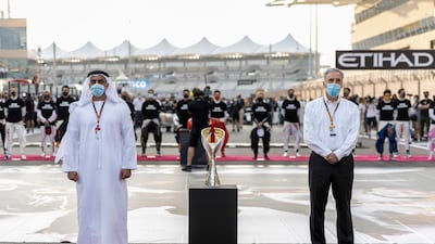 Sheikh Saif bin Zayed, Deputy Prime Minister and Minister of Interior, and Chase Carey, Formula 1 Chairman and CEO, stand for the national anthem prior to the race. Hamad Al Kaabi / Ministry of Presidential Affairs