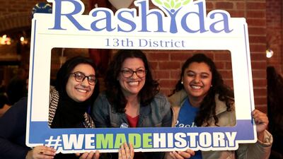 Democratic congressional candidate Rashida Tlaib, centre, celebrates at her midterm election night party in Detroit, Michigan. Reuters