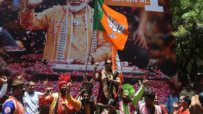 Supporters of Indian Prime Minister Narendra Modi and his ruling Bharatiya Janata Party (BJP) celebrate the election results outside the BJP headquarters in Mumbai. AFP