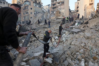 Emergency personnel work at the site of a collapsed building after an Israeli air strike in central Beirut's Bachoura. Reuters