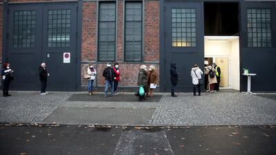 Visitors queue outside a Covid-19 vaccination site at Berlin Arena in Berlin, Germany. Bloomberg