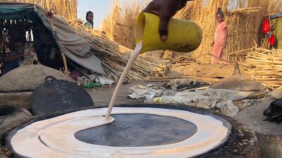 Ethiopian refugees preparing food in Hamdayet reception centre. Courtesy MSF