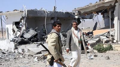 Houthi fighters inspect the damage caused by airstrikes on the airport of Yemen's northwestern city of Saada, a Houthi stronghold near the Saudi border on March 30, 2015. Naiyf Rahma/Reuters