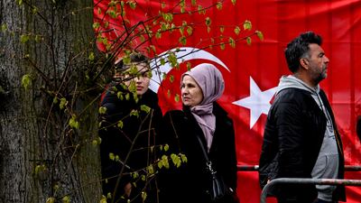 Voters queue at the Turkish embassy in Berlin to cast their ballots in the Turkish presidential and parliamentary elections. EPA