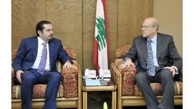 Najib Miqati, right, Lebanon's incoming prime minister, meets the outgoing premier, Saad Hariri, last week in Beirut.