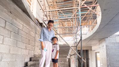 Doble and her son Zayed at the construction site. Photo: Lauren Doble
